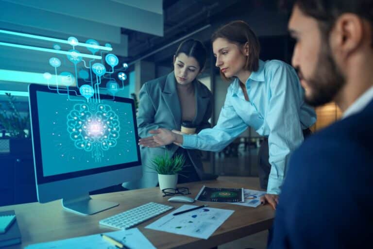Personnes utilisant les outils de l'intelligence artificielle au travail.
